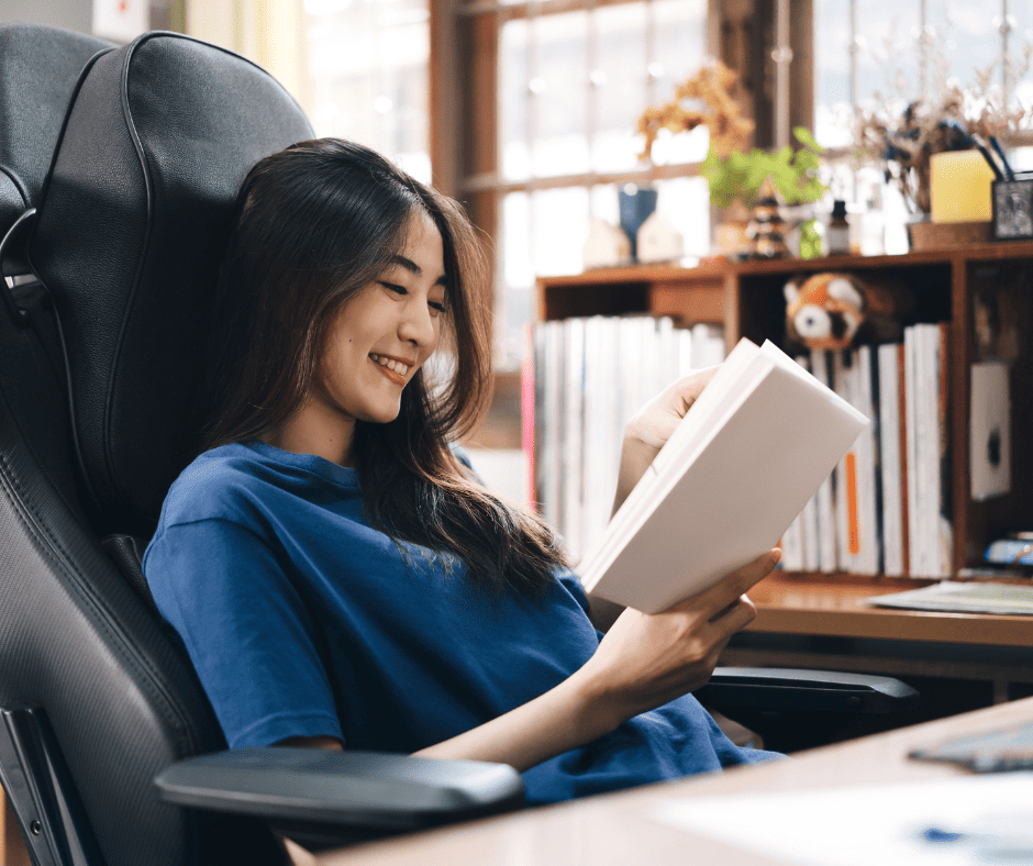 woman reading a book about breastfeeding