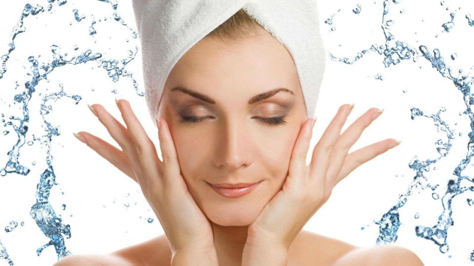 Beautiful young woman washing her face
