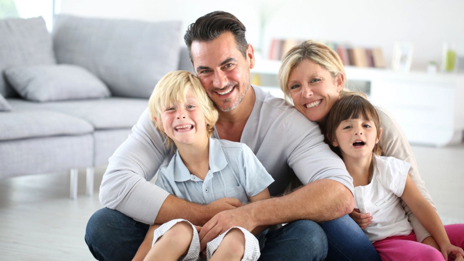 Happy family sitting on floor