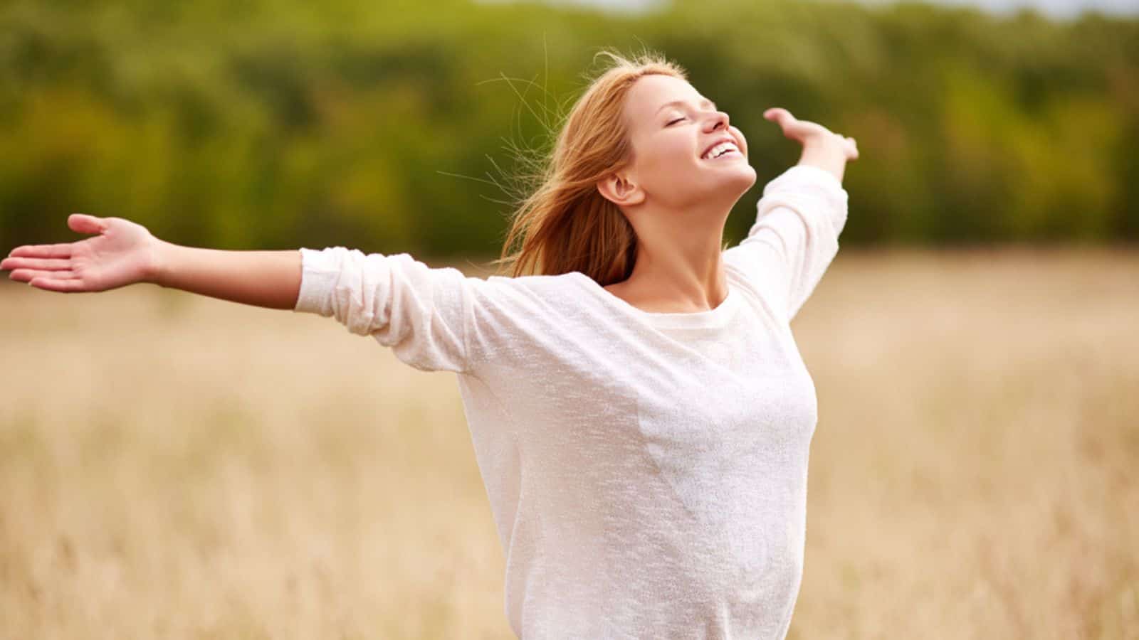 Happy young female enjoying freedom