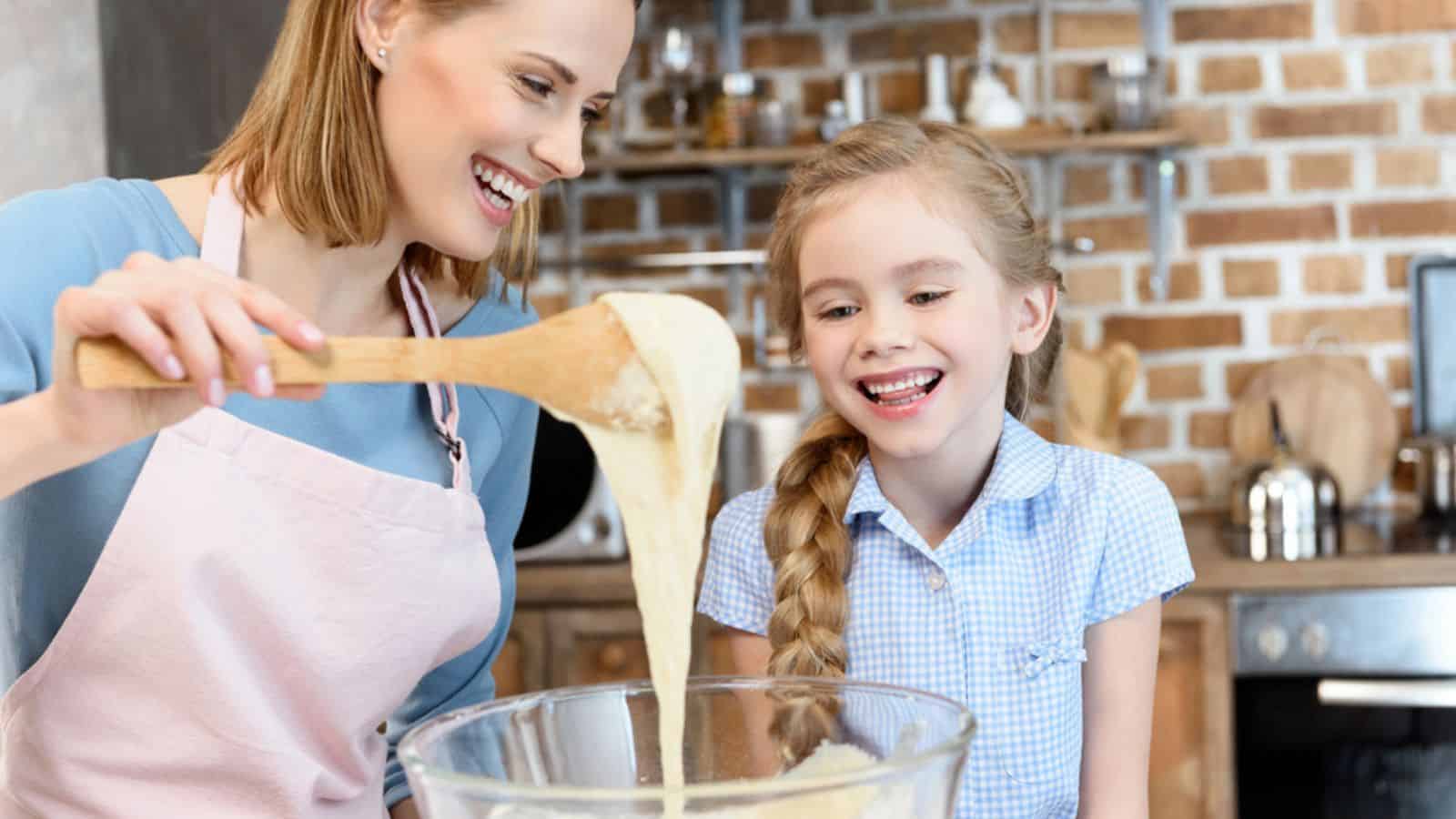 Mother and daughter preparing dough