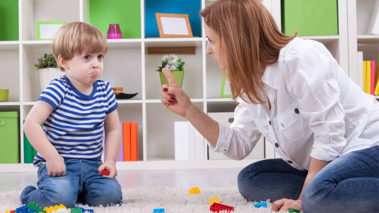 Sad child with her angry mother