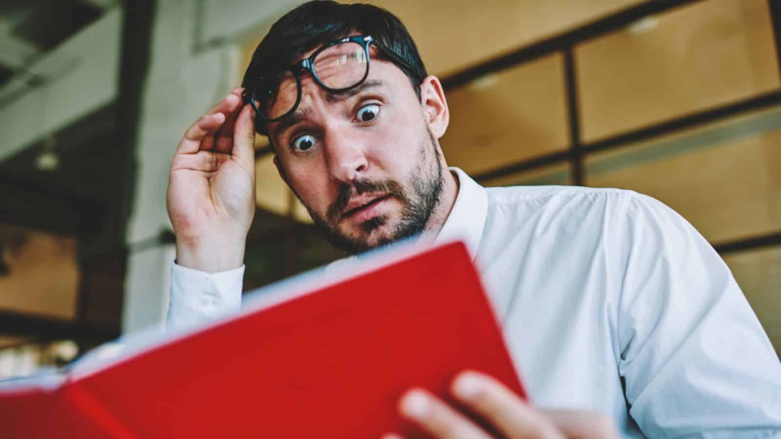 Shocked emotional male entrepreneur very surprised