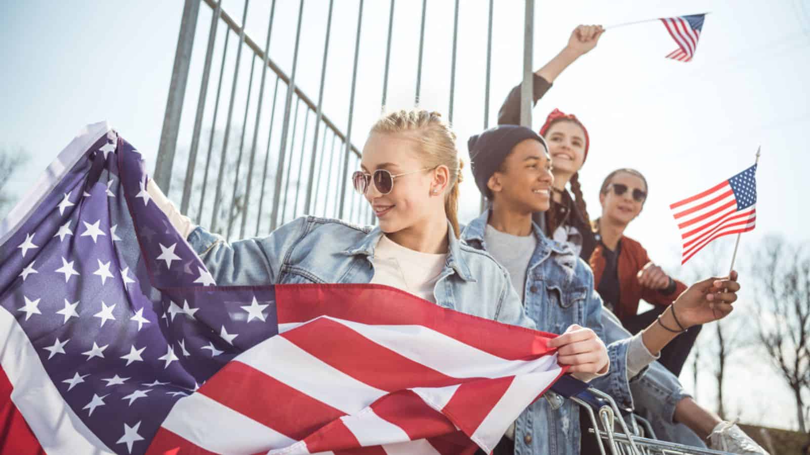 Teenagers with american flags