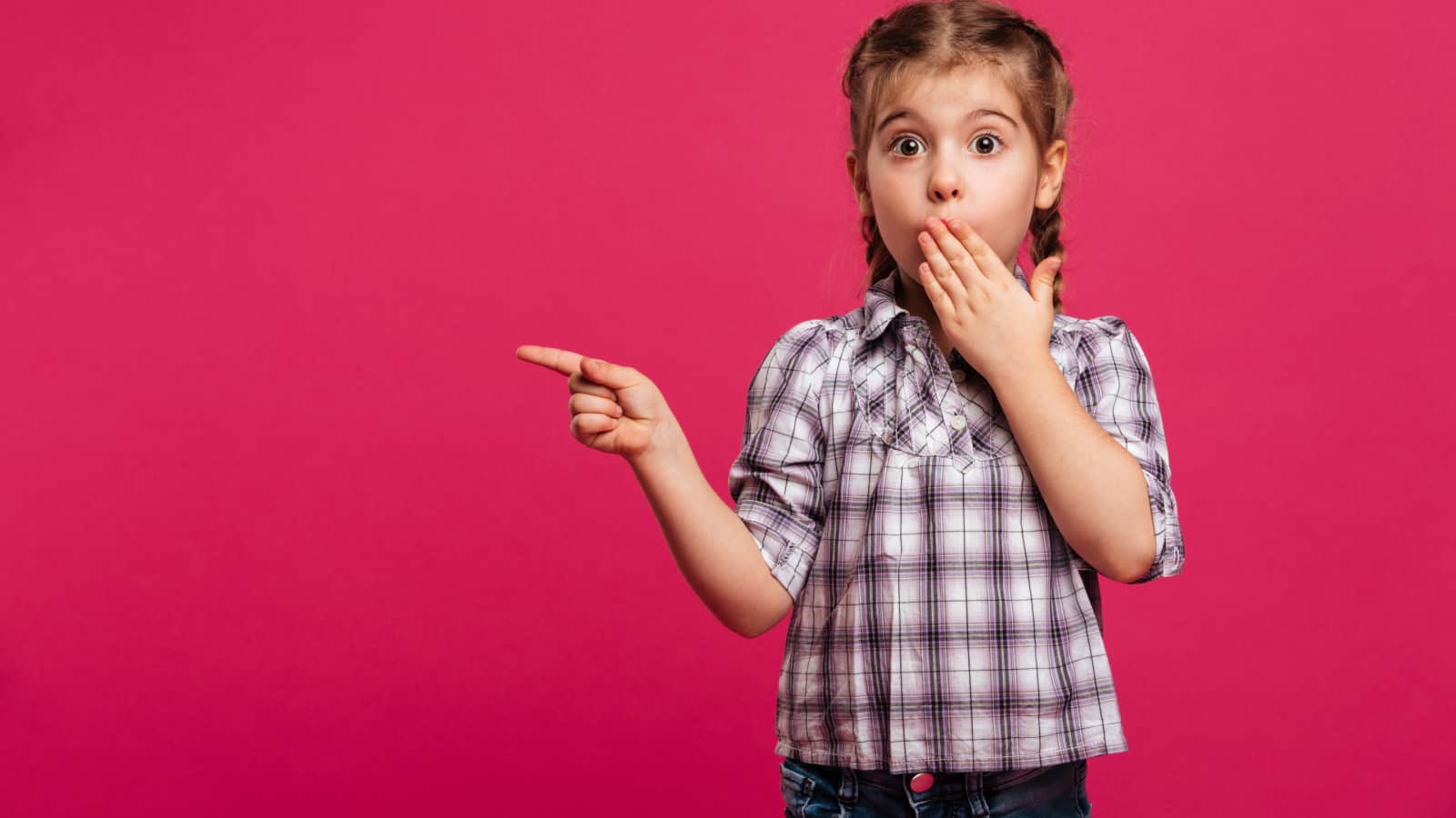 shocked girl pointing in pink