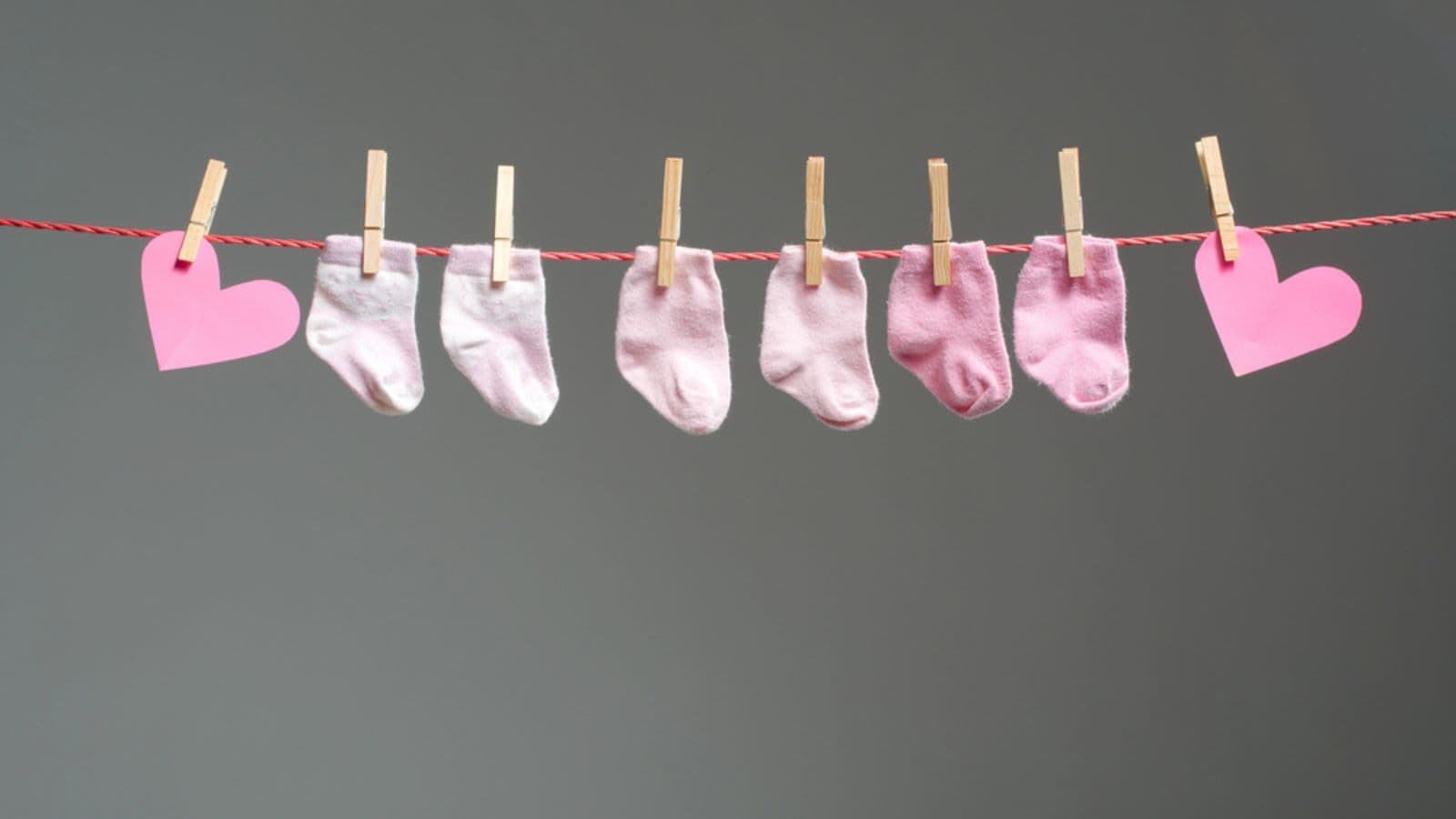 baby socks on a clothes line hearts