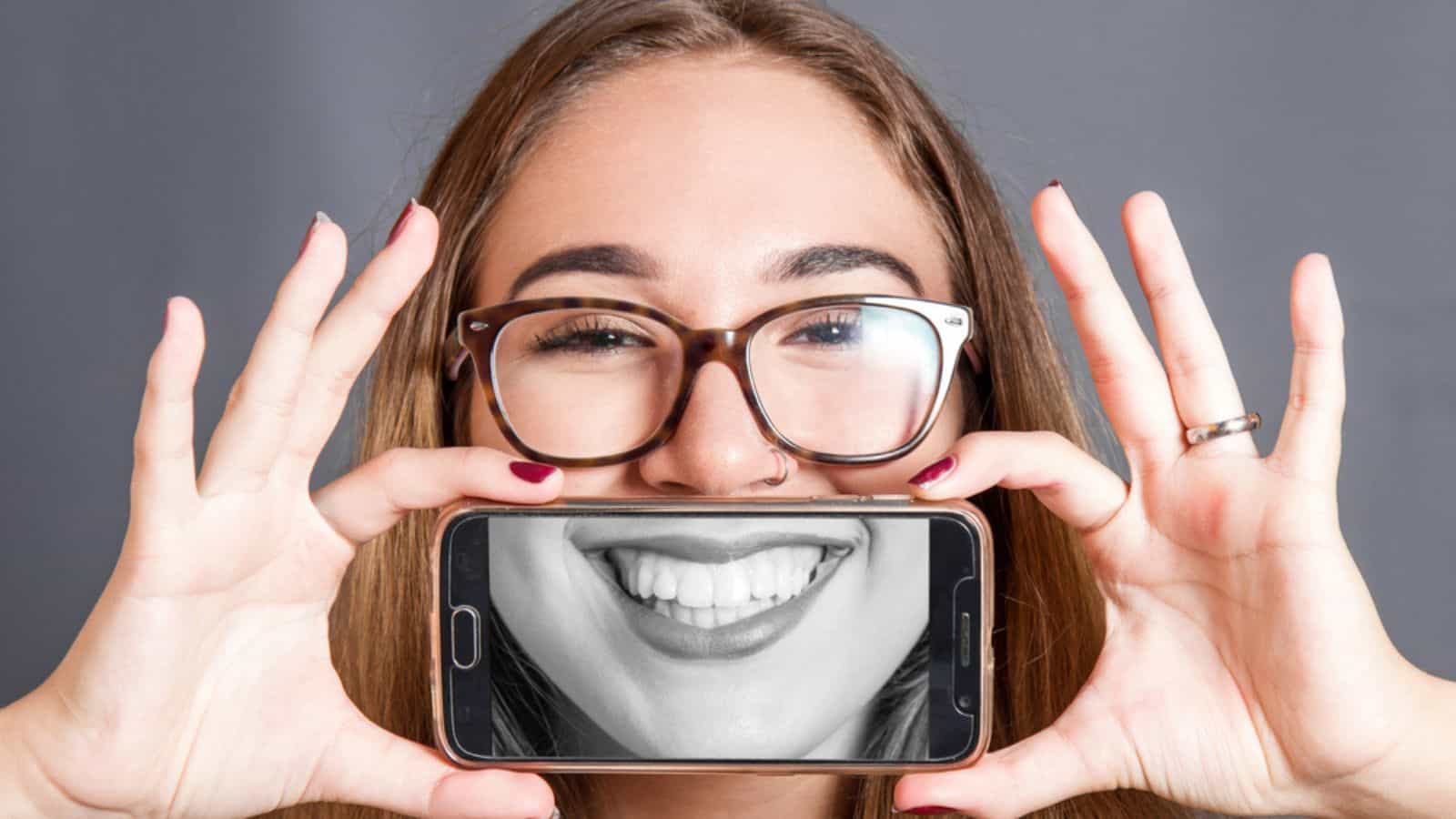 woman smiling selfie glasses