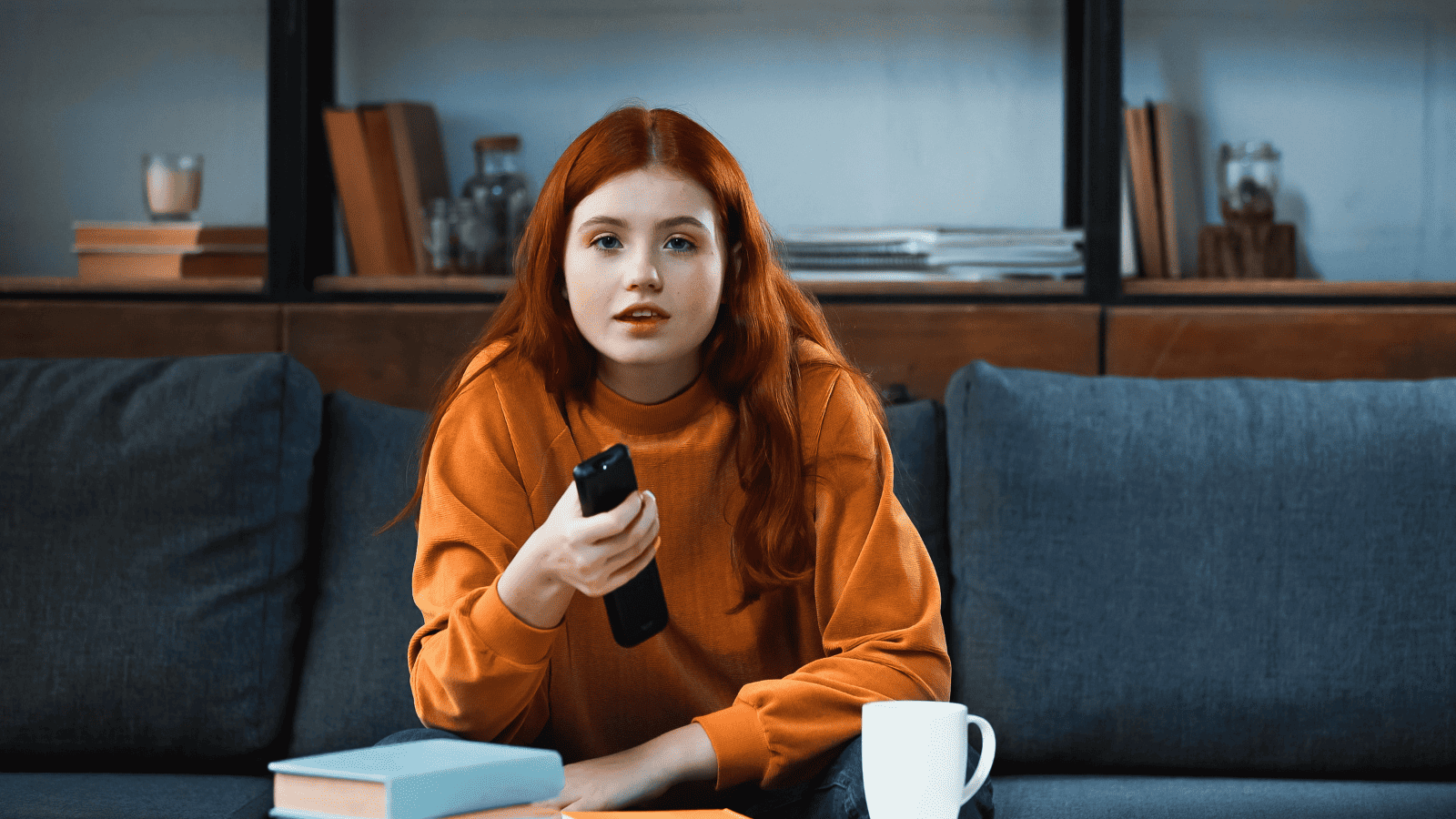 woman watching a movie tv remote coffee trance entertainment