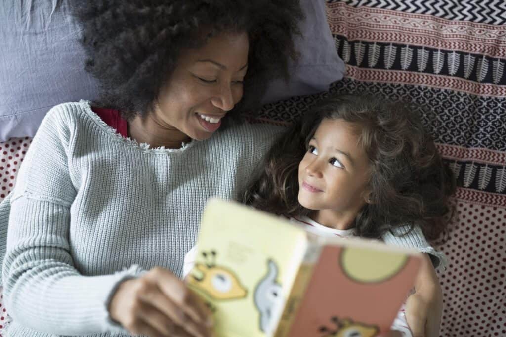 mom and daughter reading a book