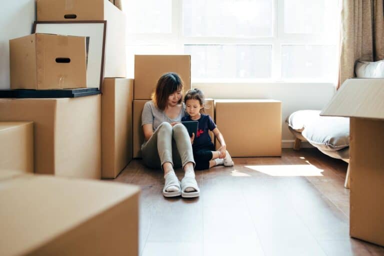mom and daughter moving with boxes