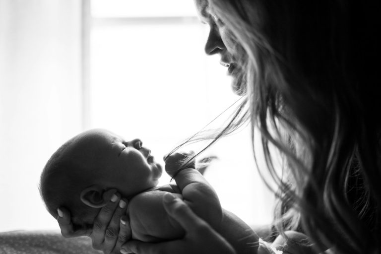 woman holding baby; baby temperament