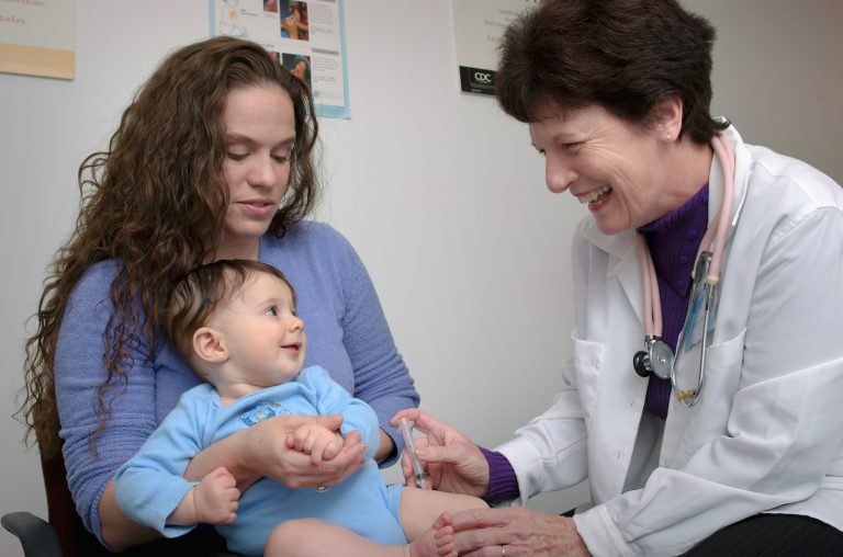 a young child is being examined by a doctor; choosing a pediatrician