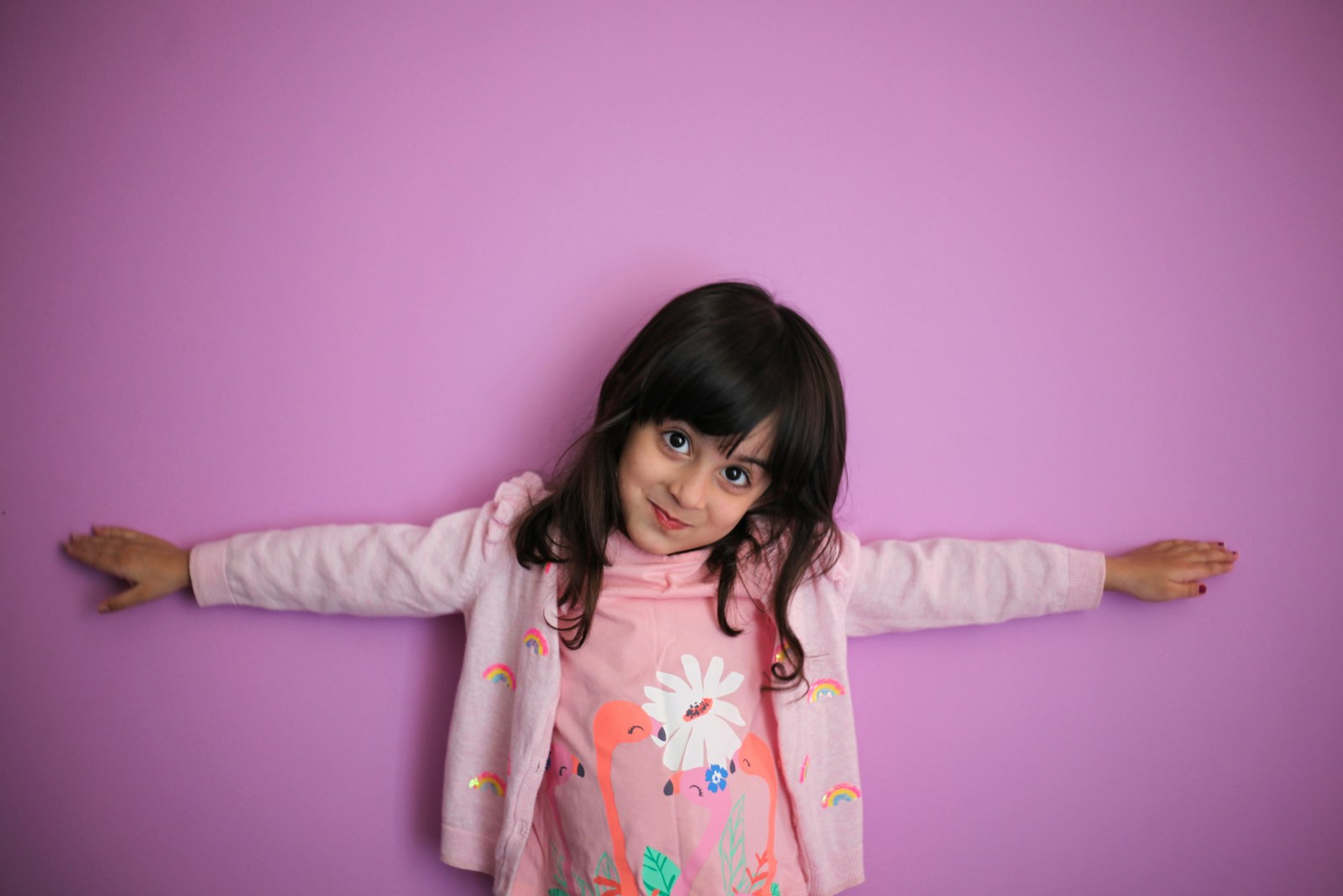 girl in pink and white floral long sleeve shirt; positive discipline strategies