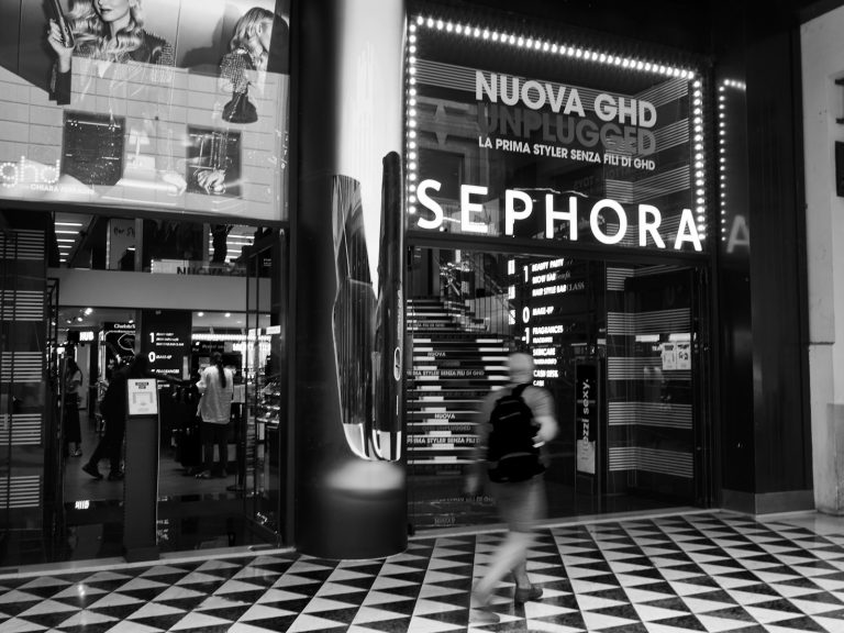 grayscale photo of people walking on sidewalk; Sephora kids trend