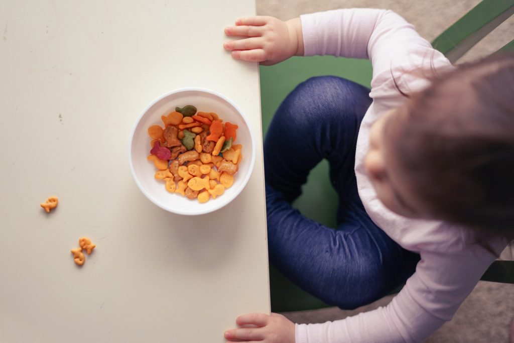 toddler sitting in front of bowl on top of table; picky toddler