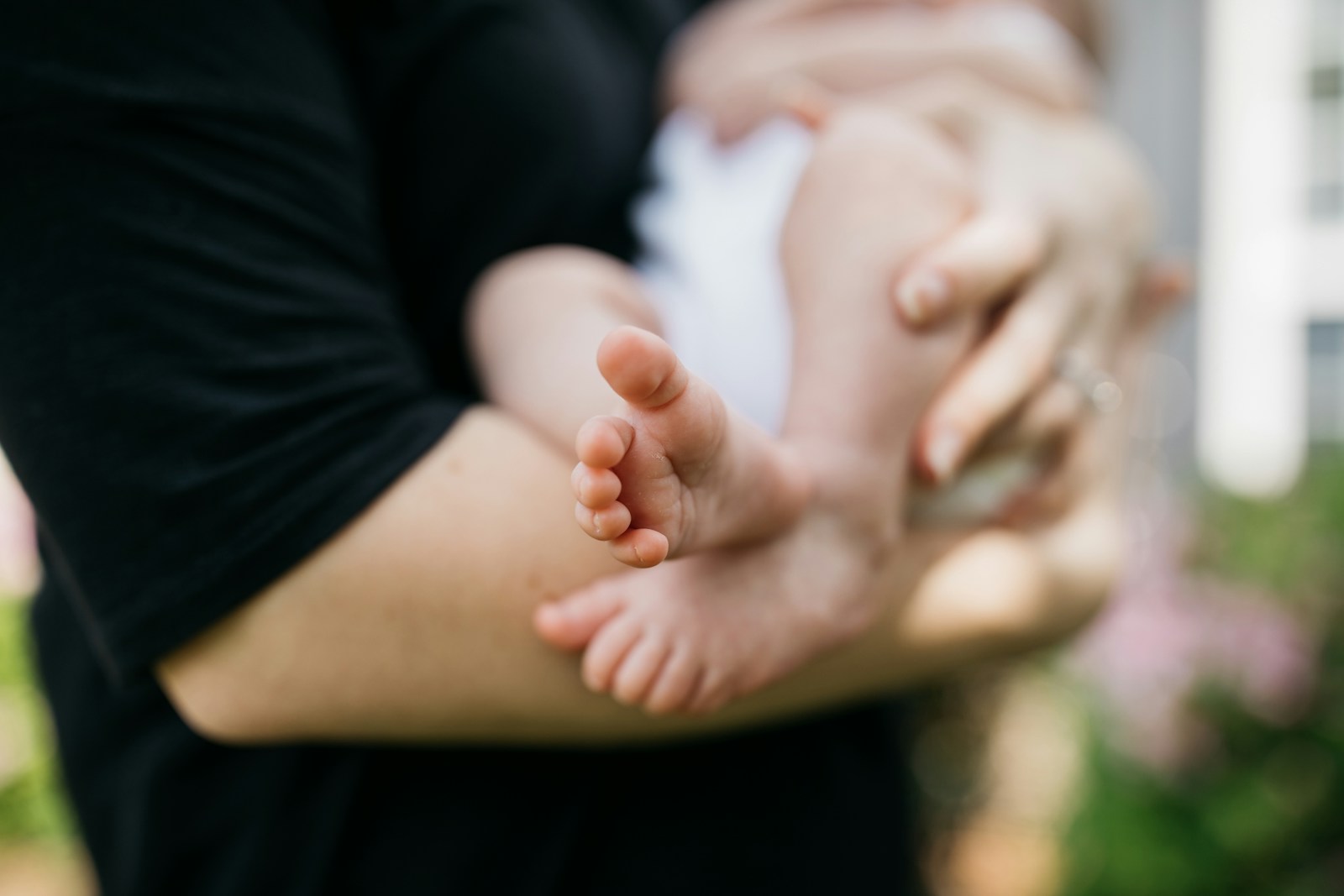 person carrying baby on arms; increase breast milk supply